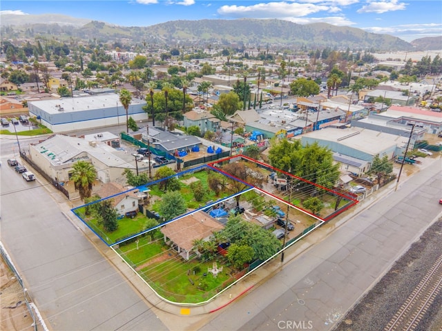 birds eye view of property featuring a mountain view