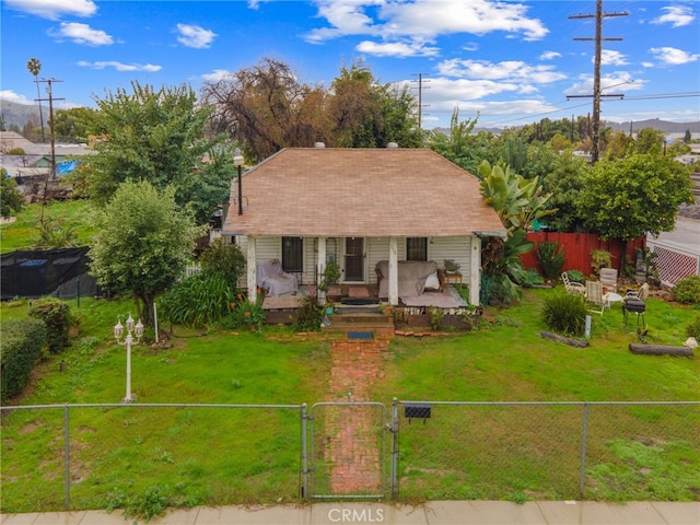 bungalow-style house with a porch and a front lawn