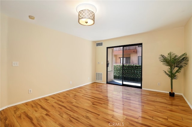 spare room with light hardwood / wood-style floors