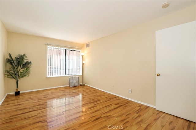 unfurnished room featuring light hardwood / wood-style flooring