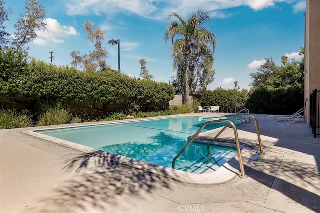 view of pool featuring a patio area