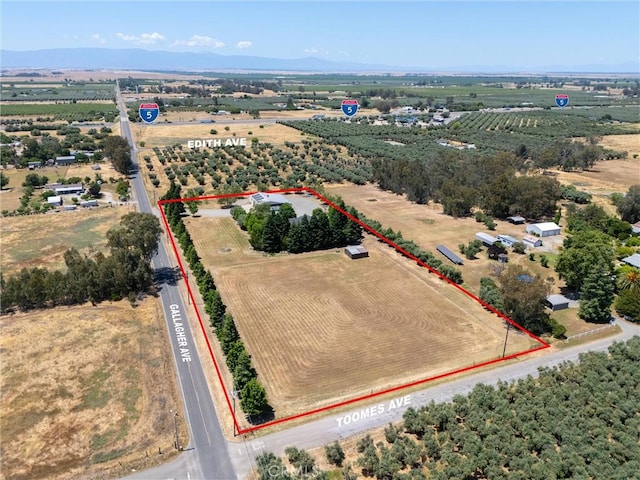 birds eye view of property featuring a rural view