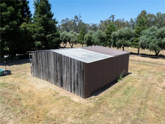 view of outdoor structure with a lawn