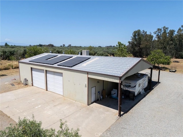 garage with central AC and solar panels