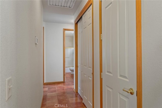 hall with light tile patterned flooring