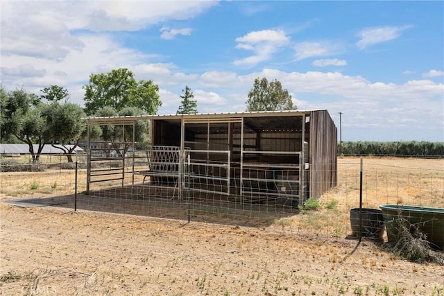 view of outdoor structure with a rural view