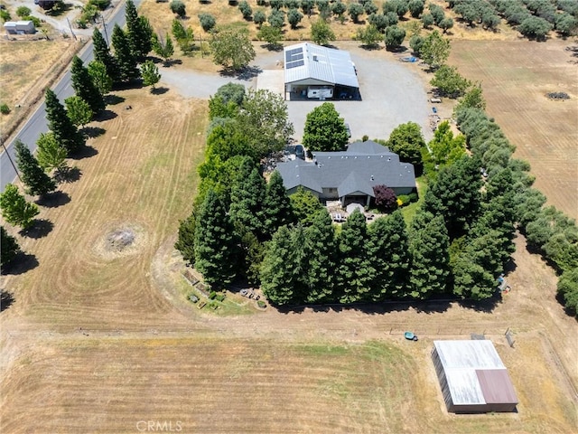 birds eye view of property with a rural view