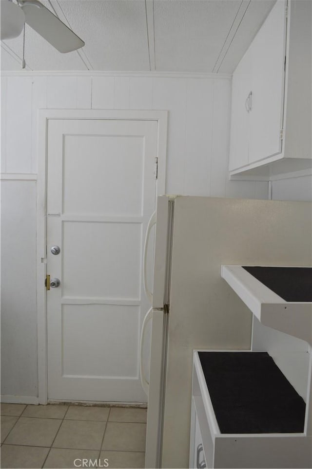 bathroom featuring tile patterned flooring and ceiling fan