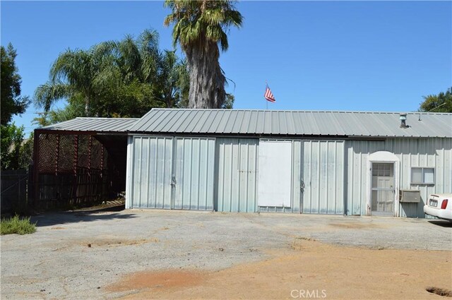 view of outdoor structure with a carport