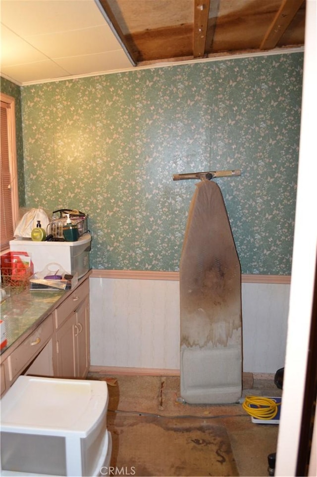 bathroom featuring beam ceiling