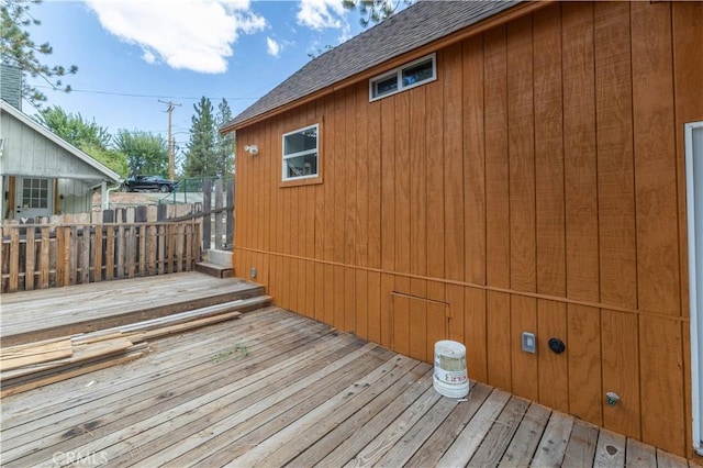 wooden terrace featuring fence