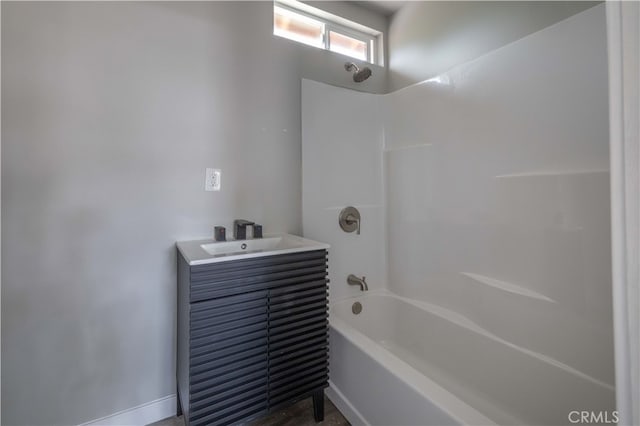 bathroom with vanity and washtub / shower combination