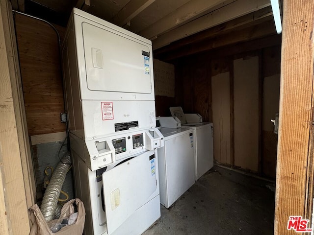 washroom with washing machine and dryer and stacked washing maching and dryer