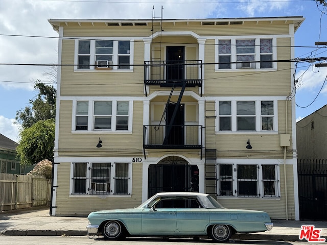 view of front of home featuring a balcony