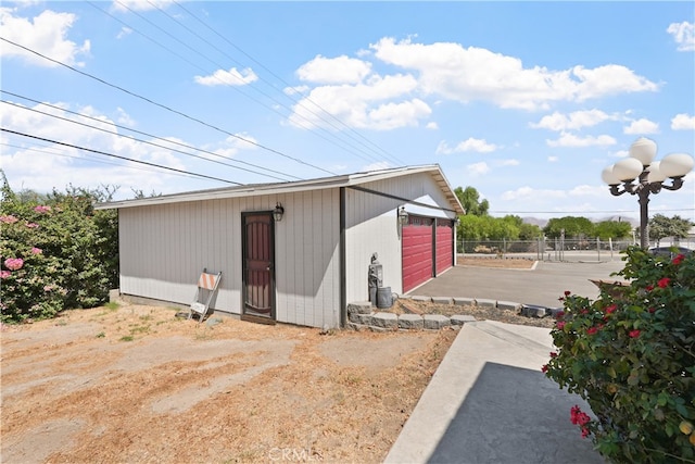 view of outdoor structure with a garage