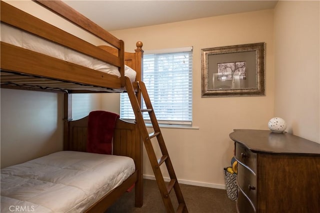 bedroom featuring dark carpet