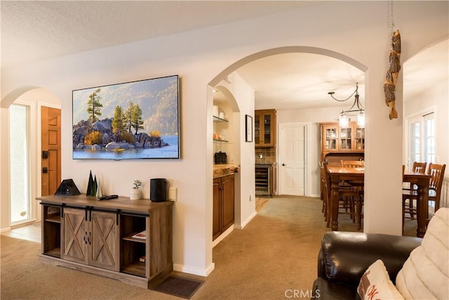 corridor featuring wine cooler and carpet