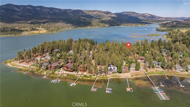 aerial view featuring a water and mountain view