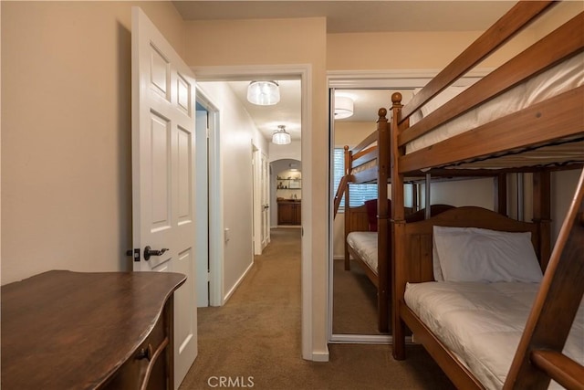 bedroom featuring dark carpet