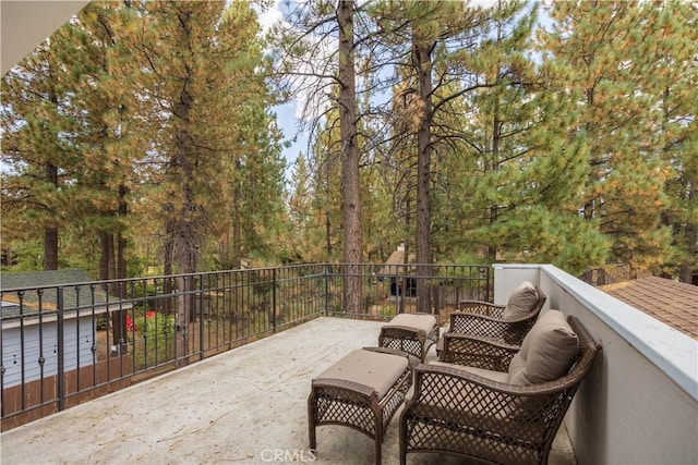 view of patio featuring a balcony