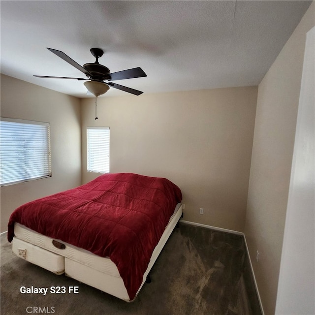 carpeted bedroom featuring ceiling fan