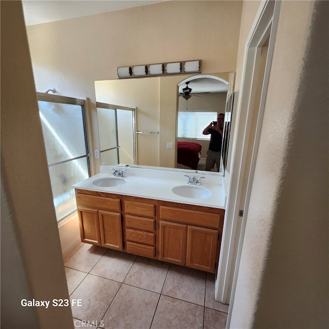 bathroom with ceiling fan, vanity, tile patterned floors, and combined bath / shower with glass door