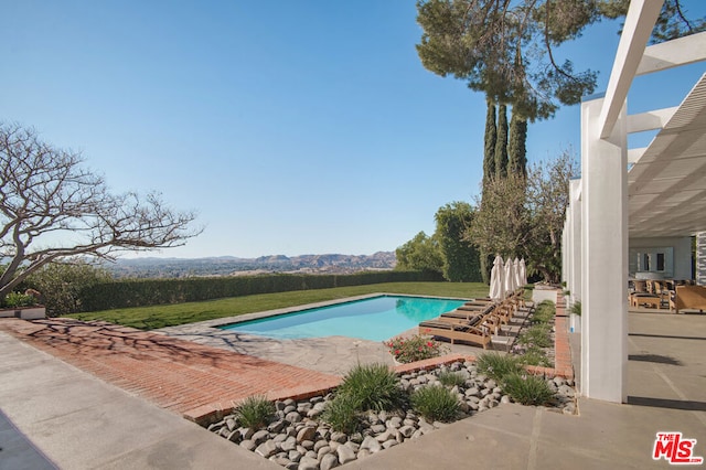 view of pool with a mountain view