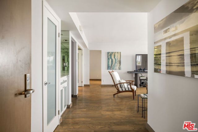 corridor with dark hardwood / wood-style floors