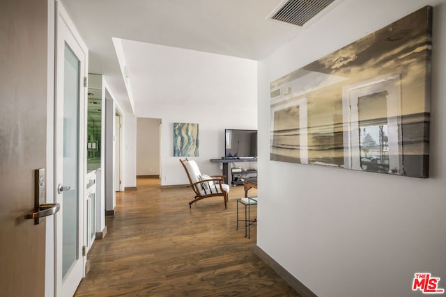 corridor with dark hardwood / wood-style floors