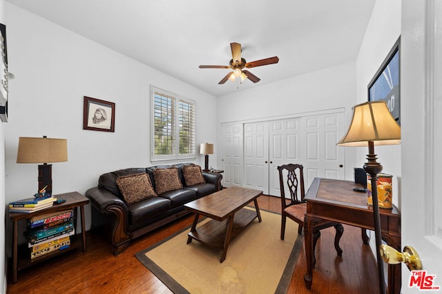 living room with ceiling fan and hardwood / wood-style floors