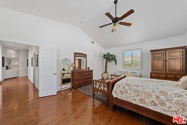 bedroom with dark hardwood / wood-style floors, ceiling fan, and high vaulted ceiling