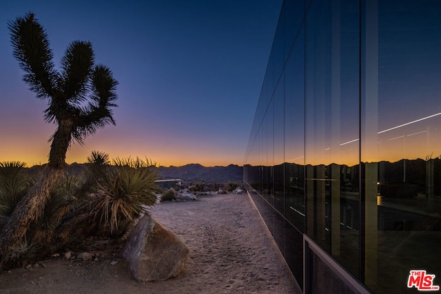 yard at dusk with a mountain view