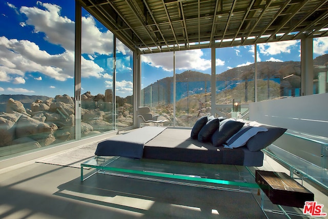 sunroom featuring a mountain view