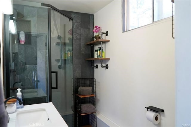 bathroom with vanity and an enclosed shower