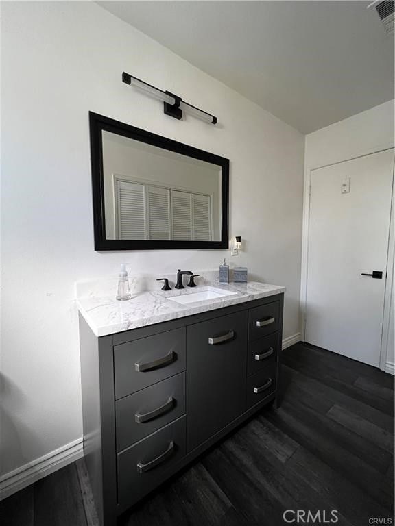 bathroom featuring vanity and hardwood / wood-style flooring