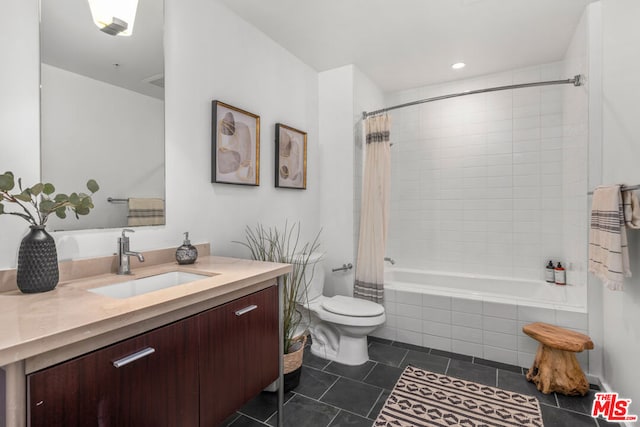 full bathroom featuring tile patterned flooring, shower / bath combo, vanity, and toilet