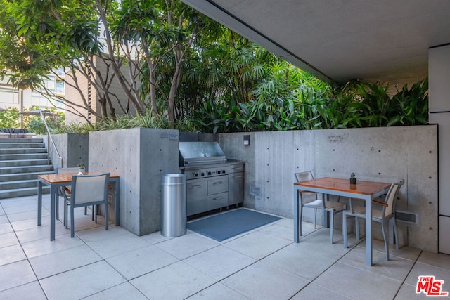 view of patio with a grill and exterior kitchen