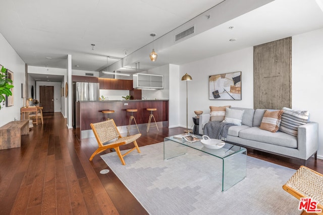 living room with dark hardwood / wood-style flooring