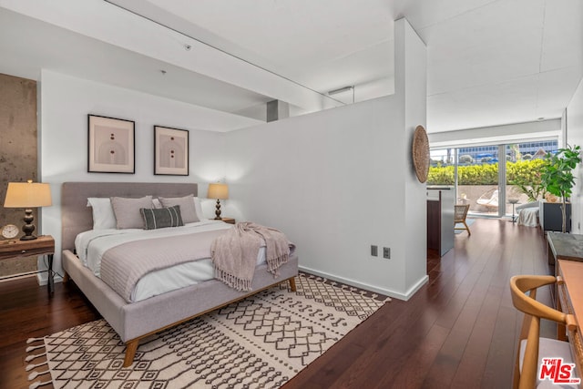 bedroom featuring dark wood-type flooring