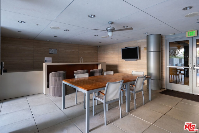 tiled dining area with ceiling fan