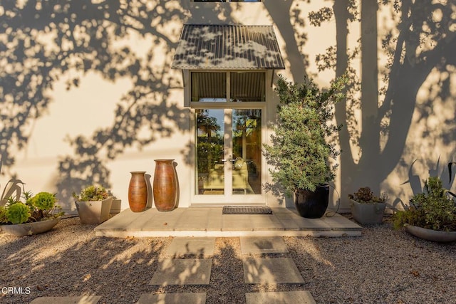 property entrance with french doors and a patio