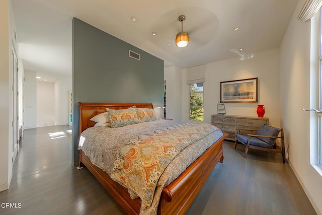 bedroom featuring ceiling fan and dark hardwood / wood-style floors