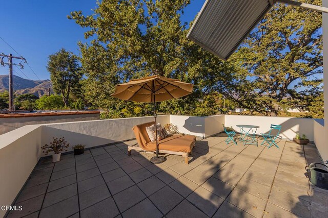 view of patio / terrace featuring a mountain view