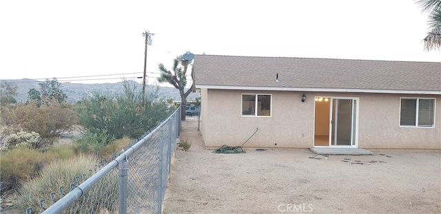 back of property featuring a mountain view