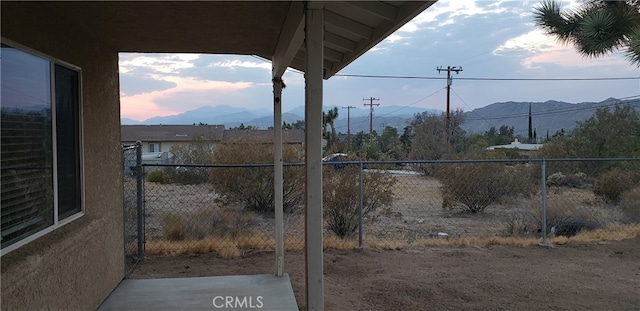 yard at dusk with a mountain view