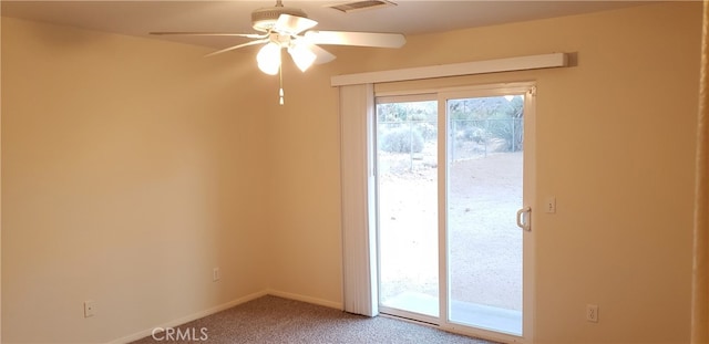 carpeted empty room featuring ceiling fan