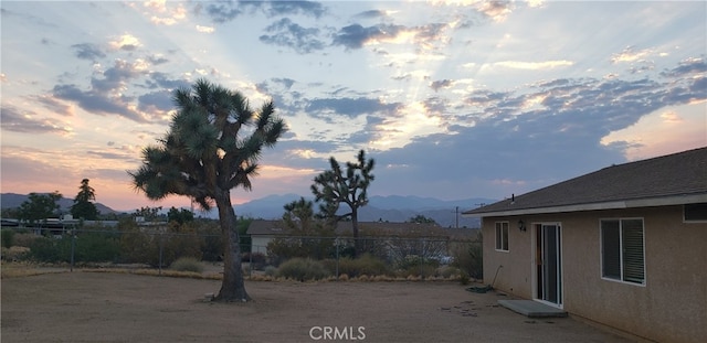 yard at dusk with a mountain view