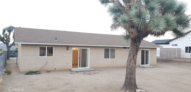 back of house with a patio