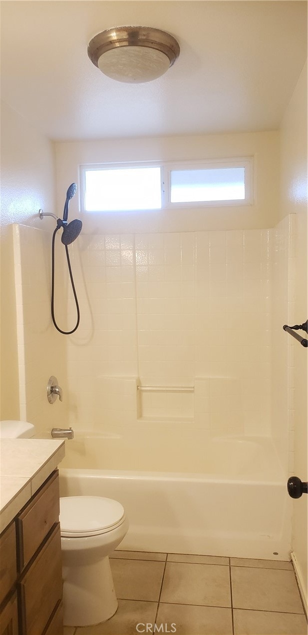 full bathroom featuring shower / washtub combination, tile patterned flooring, vanity, and toilet