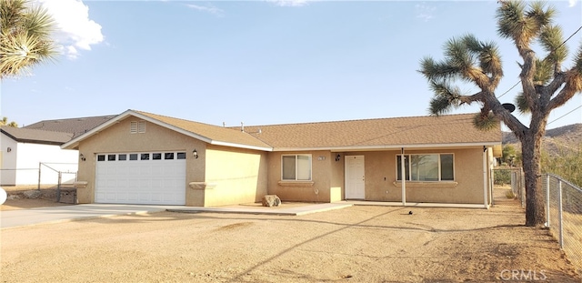 single story home featuring a garage